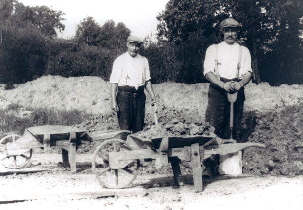 old photograph on men laying brickwork