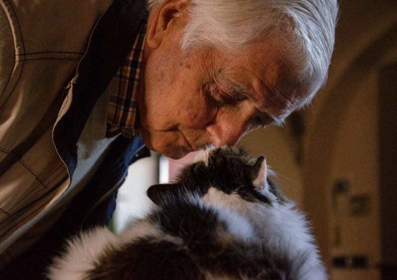 old man with his cat